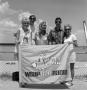 Photograph: [A family with a WBAP flag]