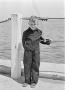 Photograph: [Photograph of Tim Williams posing by the ocean]