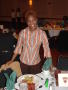 Primary view of [Student standing at her table during BHM banquet 2006]
