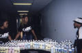 Image: [Team setting up water bottles at CoBO event]