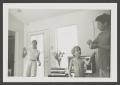 Photograph: [Photograph of Pam Williams, Derrick and Byrd V in a living room]