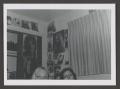 Photograph: [Photograph of Dana and Pam in a bedroom]