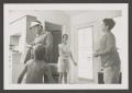 Photograph: [Photograph of Pam, Ray, Derrick and Byrd V in an apartment]