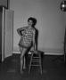 Photograph: [Doris leaning on a stool, 2]
