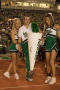 Photograph: [Cheerleader balancing cone on his toe at homecoming, 2007]