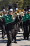 Photograph: [Mean Green Brigade playing trombones in UNT Homecoming Parade, 2007]
