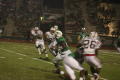 Primary view of [Casey Fitzgerald running past FAU players, September 22, 2007]