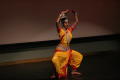 Photograph: [Student in pose on stage at ISA Diwali event]