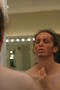 Photograph: [Actor applying stage makeup]