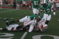 Primary view of [Cortez Gent being tackled, September 22, 2007]
