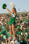 Photograph: [Cheerleader in high-v at UNT vs. Navy game, 2007]