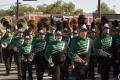Photograph: [Mean Green Brigade marching in UNT Homecoming Parade, 2007]