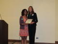 Photograph: [Cara Walker and Lauren Helixon holding certificate]