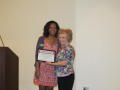 Photograph: [Cara Walker and Carolyn Blevins with certificate]