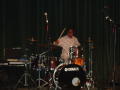 Photograph: [Drummer on stage at Multicultural Center event]