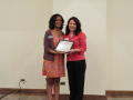 Photograph: [Cara Walker and Laurea Irving holding certificate]