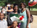 Photograph: [Graduate with family and flowers]