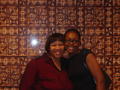 Primary view of [Cheylon Brown and guest in front of mural]