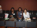 Photograph: [Three women seated at 2005 Women of Color Conference]
