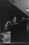 Photograph: [Pearl S. Buck standing at podium]