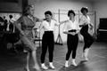 Primary view of [Alice Faye dancing with three young women]