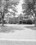 Photograph: [The front of a house taken from the street]