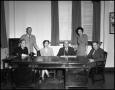 Thumbnail image of item number 1 in: '[Male and female administrative staff in office at North Texas State Teachers College]'.