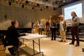 Photograph: ["Eclective" group presenting to judge David Cutler at the UNT Music …