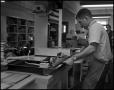 Photograph: [Book Bindery - Process - Male Individual - 1963]