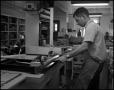 Photograph: [Book Bindery - Process #2 - Male Individual - 1963]
