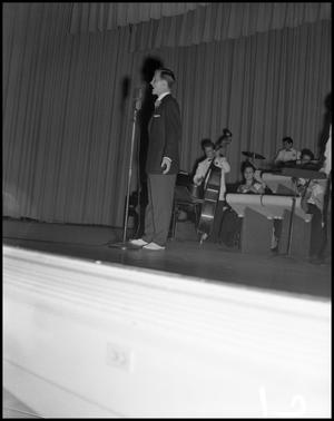 Primary view of object titled '[Pat Boone singing onstage]'.