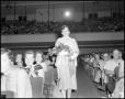 Photograph: [Shirley Boone holding a bouquet]