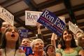 Photograph: [Women stand in crowd at Ron Paul rally]