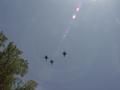 Photograph: [Military aircrafts fly over outdoor TXSSAR event]