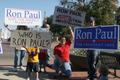 Photograph: [Photograph of a group holding Ron Paul signs on the Square 4]