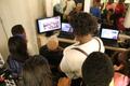 Photograph: [Students watch footage at 2016 TBAAL Summer Youth Arts Institute]