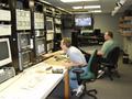 Photograph: [CMP staff in production control room, view from left, 1]
