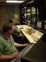 Photograph: [CMP staff in production control room, view from right, 1]