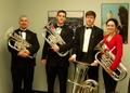 Photograph: [UNT tuba players pose with instruments]