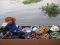 Photograph: [Woman in floating market boat, 2]