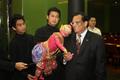 Photograph: [Vish Prasad poses with Thai puppet, 4]