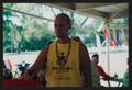 Photograph: [Volunteer in a yellow LSR tank top: Lone Star Ride 2002 event photo]