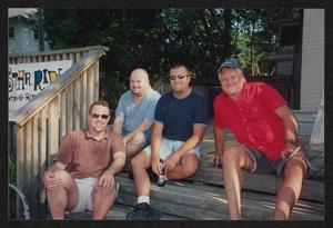 Primary view of object titled '[4 people sitting on deck stairs: Lone Star Ride 2003 event photo]'.