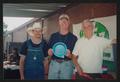 Photograph: [Man holding a blue paper plate: Lone Star Ride 2003 event photo]