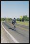 Photograph: [Cyclist pointing to the camera: Lone Star Ride 2003 event photo]