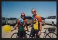 Primary view of [Two cyclists both in multicolored jerseys: Lone Star Ride 2003 event photo]