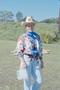 Photograph: [Crew member in cowgirl costume: Lone Star Ride 2001 event photo]