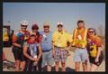 Photograph: [Three crew members and four riders: Lone Star Ride 2001 event photo]