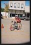 Photograph: [Cyclist in front of the Talley building: Lone Star Ride 2005 event p…