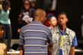 Primary view of [Stephen Semien with students during Motown Motown rehearsal, closeup]
